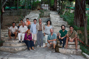 The team  posing at the foot of some steps.
